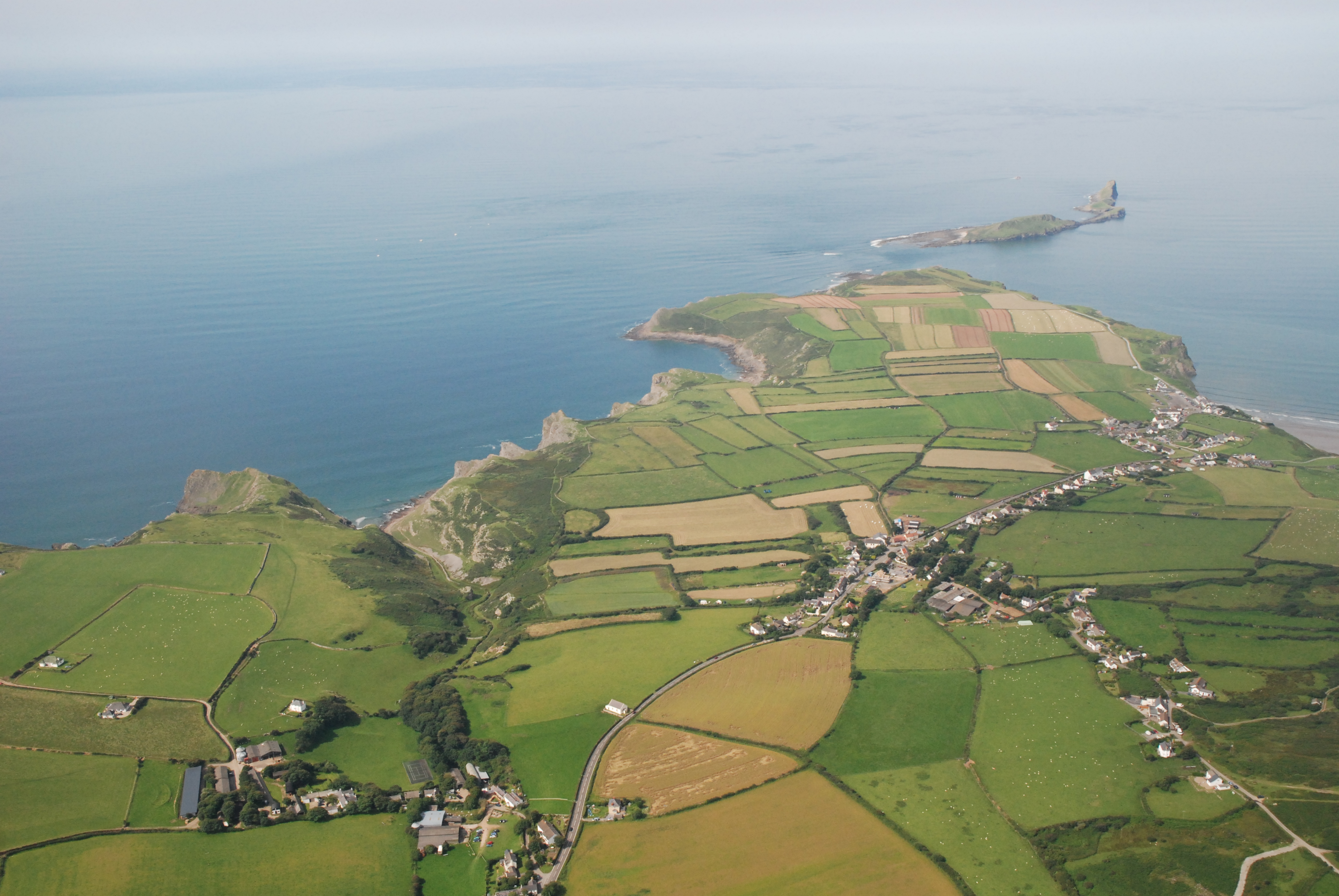 Aerial view of Gower showing Worms Head and Rhossili © Pixaerial.com 